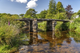 The medieval stone slab bridge Clapper Bridge in Postbridge, Dartmoor, Devon, England, Great