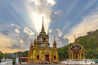 Sunbeams over the Buddhist temple Wat Namtok Mae Klang in Ban Luang, Chom Thong, Chiang Mai,