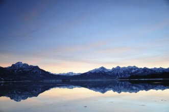 Sunset at the Forggensee near Füssen in the Allgäu, on the left the Säuling (2047 m), Bavaria,