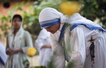 Nuns offer prayers on the grave during the All souls day observation, in Guwahati, India on 2