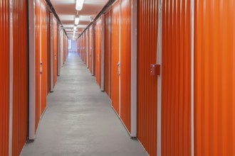 Orange interior of self storage rental units at an enclosed mini warehouse facility in Gulfport,