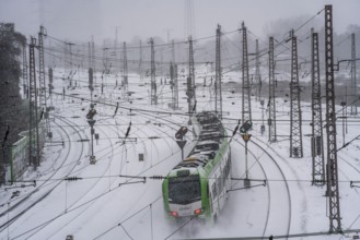 Onset of winter with lots of fresh snow and temperatures below -5 degrees during the day, railway