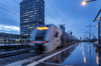 RRX train, regional express, Rhine-Ruhr-Express, train traffic, city centre skyline, Essen central