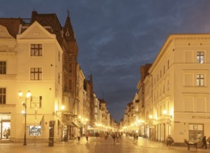 The medieval old town of Thorn illuminated in the evening. The historic city centre of Torun is a