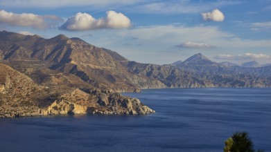 Panorama of mountains and sea in sunny weather, morning light, sunrise, coastal road, east coast,