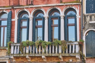 Windows of an old house on 'Campo santa margherita' town square in Venice on a sunny day in winter,