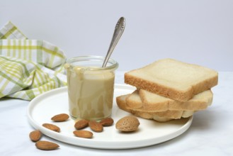 Almond cream in a jar and toast