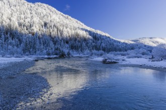 Isar valley in winter at temperatures of minus 18 degrees Celsius. Snow covered landscape with the
