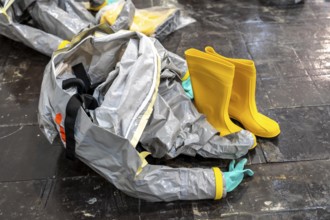 Protective suits are ready, decontamination of injured persons after an assumed accident involving