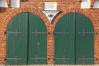 View of two green wooden gates of a fire station, Bücken, Hoya, Nienburg, Lower Saxony, Germany,