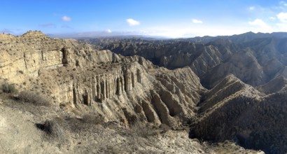 Wide hilly desert landscape with dry vegetation, Gorafe desert, semi-desert, Granada, Andalusia,