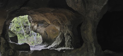 The Hohllay cave showing grooves and circles in the sandstone rock from carving millstones,