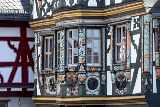 Killingerhaus, magnificent half-timbered house, colourful painted carvings on the bay window,
