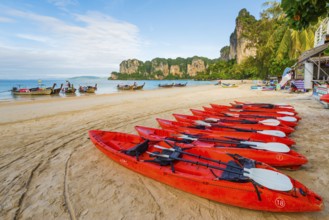 Beach landscape with kayak boats near Krabi, longtail boat, water taxi, wooden boat, weather, sky,