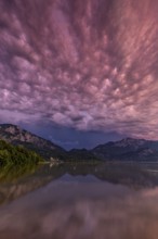 Stormy atmosphere, mountains reflected in lake, Lake Kochel, Alpine foothills, Bavaria, Germany,