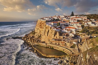 Scenic view of the seaside Azenhas do Mar fishing village on cliff on Atlantic ocean coast,