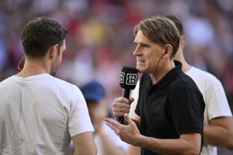 Interview with sports director Christoph Freund FC Bayern Munich FCB, microphone, mike, logo, DAZN,