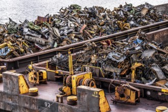 Push barge, loaded with scrap metal, for recycling, melting down, in the harbour canal,
