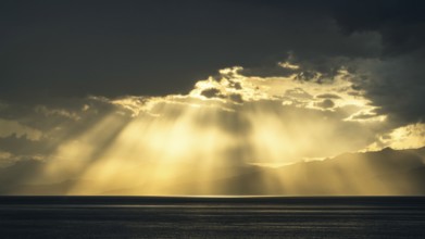 Sun rays in the clouds over Sicily, Tyrrhenian Sea, Italy, Europe