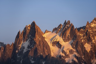 Rocky pointed mountain peaks at sunset, alpenglow, Aiguille du Plan, Mont Blanc massif, Chamonix,