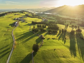 Mountain range near village Wertach, view to lake Gruentensee, sunrise, autumn colors, aerial view,