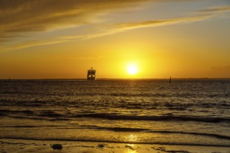 Intense sunset on the west beach of Norderney, ferry, Lower Saxony, Germany, Europe