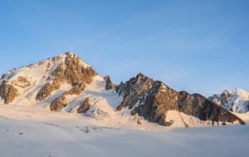 High alpine mountain landscape at sunset, summit of the Aiguille de Chardonnet and Glacier du Tour