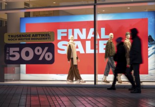 Final Sale, Clothing department stores' on Schadowstraße, large poster in the shop window