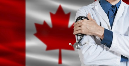 Doctor with stethoscope on Canada flag. Doctor holding stethoscope on Canada flag