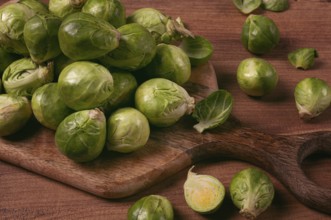 Fresh Brussels sprouts, raw, top view, on a wooden table, no people