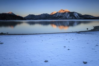 Sunrise over mountain lake, reflection, winter, Walchensee, view of Herzogstand and Heimgarten,