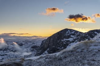 Snow-covered mountains at sunrise with dramatic clouds, Upper Austria, Austria, Europe
