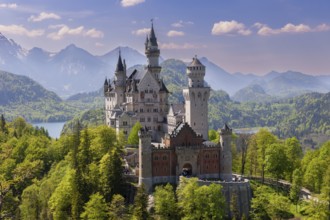 Royal castle in front of an impressive mountain landscape and graceful architecture, Schwangau,