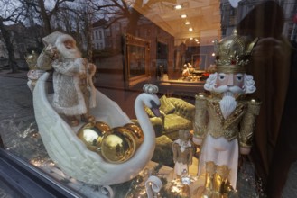 Artistically decorated window with Christmas figures and swan, Hotel Die Swaene, Bruges, West