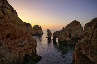 Coloured cliffs and sunrise, rocks in the sea, Ponta da Piedade, Lagos, caves, cliffs, Atlantic