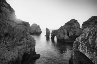 Coloured cliffs and sunrise, rocks in the sea, Ponta da Piedade, Lagos, cliffs, Atlantic Ocean,