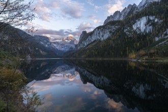 The Vordere Gosausee lake in autumn with a view of the Dachstein mountain range. The Gosaukamm on