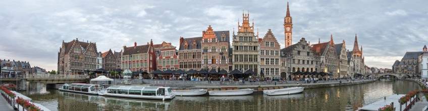 Panoramic view of historic buildings along a canal in the evening, Ghent