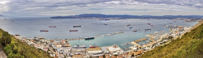 Overview of a harbour and cityscape by the sea, Gibraltar, Europe