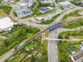 Bird's eye view of the town with traffic routes and bridges, track construction, rail delivery for