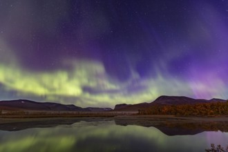 Northern lights, aurora borealis, reflected in lake, mountains, autumn, autumn colours,