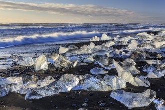 Ice floes on the beach, waves, sea, sunny, morning light, winter, Diamond Beach,