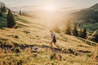 Summer trail running and hiking in the Alps on the Riedberg Pass between Obermaiselstein and