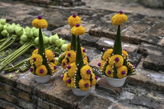 Offerings in front of the reclining Buddha, Wat Lokayasutharam, temple of the reclining Buddha,