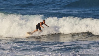 Surfer moving on a foamy wave, wave surfer, surfer, surf, waves, west coast, Arkasa, Karpathos,