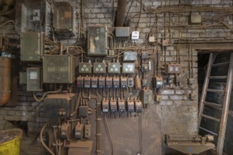 Wall with switches and fuses in the bronze powder production building, founded in 1900, metal