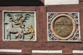 Colourful painted carvings, relief for blacksmith Johenrich Jung, medallion with inscription, on