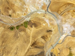Steaming hot springs and colourful rhyolite mountains, aerial view, Hveradalir geothermal area,