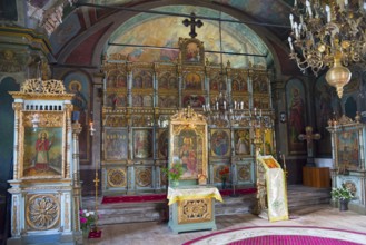 Interior view of a church with richly decorated iconostasis and religious ornaments, Suzana