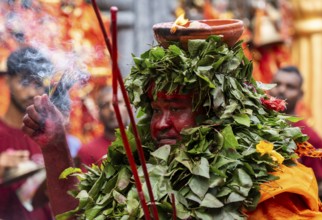 GUWAHATI, INDIA, AUGUST 19: Priest dance in the beat of Dhol (Drum) during the annual